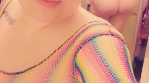 Round ass Curvy Latina feeling sexy in rainbow fishnet top and thong