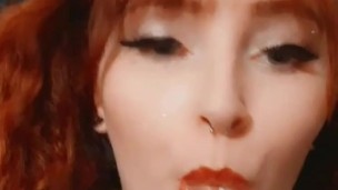 Redhead tease with a sucker 