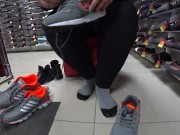 Foot fetish in a public shoe store. Fat legs try on sneakers. 11/16