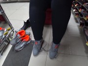 Foot fetish in a public shoe store. Fat legs try on sneakers. 14/16