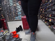 Foot fetish in a public shoe store. Fat legs try on sneakers. 15/16