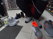Foot fetish in a public shoe store. Fat legs try on sneakers. 6/16