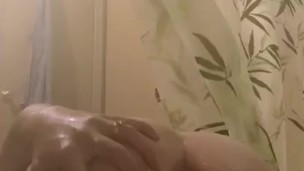 Horny teen plays with herself in shower 
