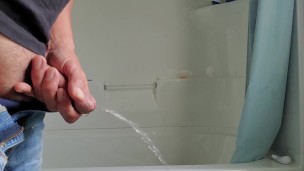 Squeezing my cock while pissing
