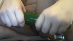 Busty teen tries to stick cucumber up tiny asshole