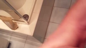 Thick cock wanked in bathroom, cums in bath