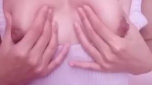 Tiny busty asian teen massaging her tits with oil