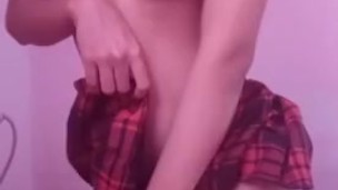 Asian schoolgirl showing off her body