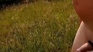 Naked walking in field flashing by main road with balls tied up 