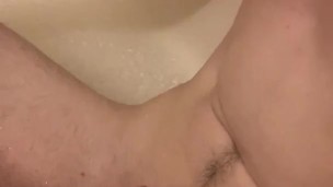 Twink jerks pierced cock in shower.