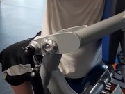 Tattooed muscular guy sweating in the gym 