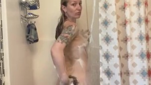 Blonde girl taking a shower 