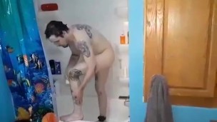 Young Tattooed Man Showering