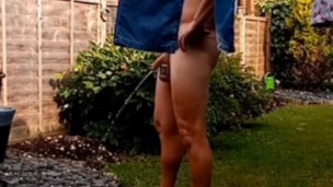 Naked and pissing in the garden 