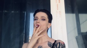hot girl in red lipstick smoke on the balcony only in bra