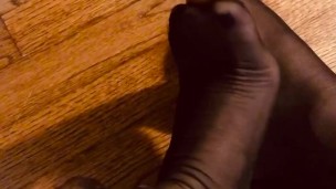 Chair Leg and Ruffled Stocking Feet 