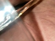 BBW Mistress pisses into glass.  While her pet holds the glass.