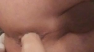 Riding 7 inch dildo on the bed