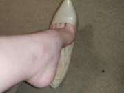 Shoeplay in tan heels. Dangling and dropping