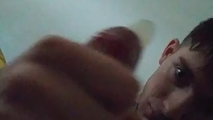 Gay guy masturbates into condom for the day's wear