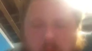 Fat guy sucking on dildo