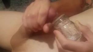 Cum drinking boy masturbates into a glass and drinks his own cum