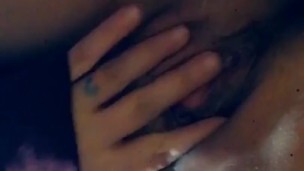 Tatted natural girl plays with her pussy