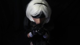 Silicone doll with 2B cosplay gives blowjob to strapon