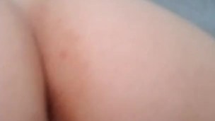From behind