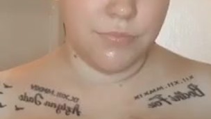 Sexy blonde babe with huge tits, playing with them in hot shower