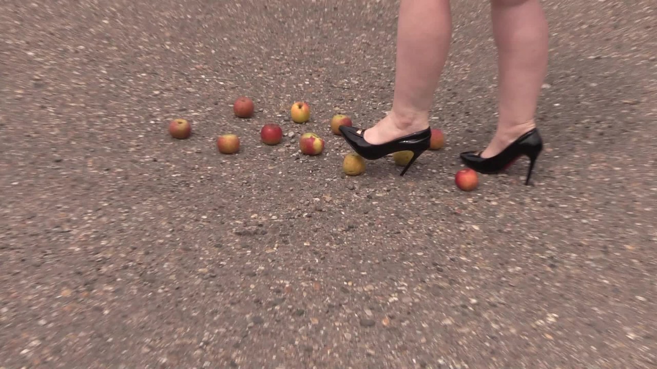 Crush fetish outdoors Fat legs in high heel shoes crush apples