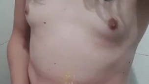 Small cock trans girl pissing on herself