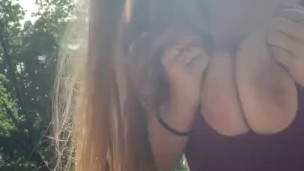 Teen show boobs in the park surrounded by people