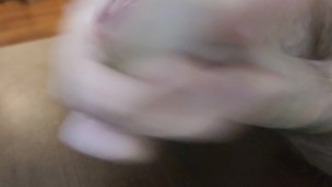 A closeup uncut precum and cumshot