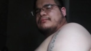 Chubby teen fucking his ass with a black dildo