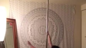 Pole dancing topless at home