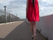 Walk along the promenade with anal plug in pussy. 3/16