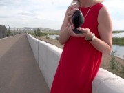 Walk along the promenade with anal plug in pussy. 6/16