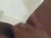 Black slut pisses in the shower