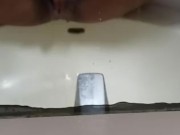 Black slut pisses in her sink