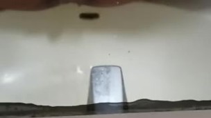 Black slut pisses in her sink