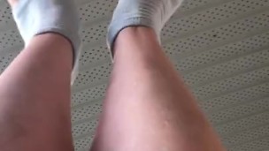 Stretching my cute feet with white painted toenails 