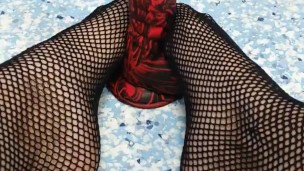 Amatuer teen gives foot job in fishnets