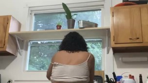 Latina MILF having fun doing the dishes
