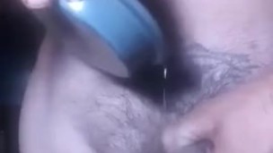 Pouring wax over hard cock