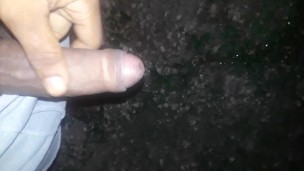 BBC pissing outdoors, stroking at end 