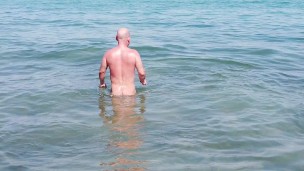 Gay nudist beach swimmer