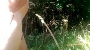Naked walk in bushes by road. 