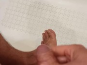 In the bathroom I jerk off and cum on my feet. I dream that you lick the sperm from the leg.
