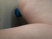 Girl masturbates with big blue dildo
